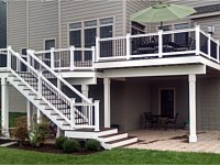 <b>Trex Composite deck with white vinyl railing & black ballusters, facia board and wrapped beams & posts</b>